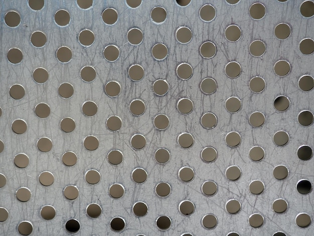 Metal surface in a hole Leaky iron Metal background The surface of the seat at the station