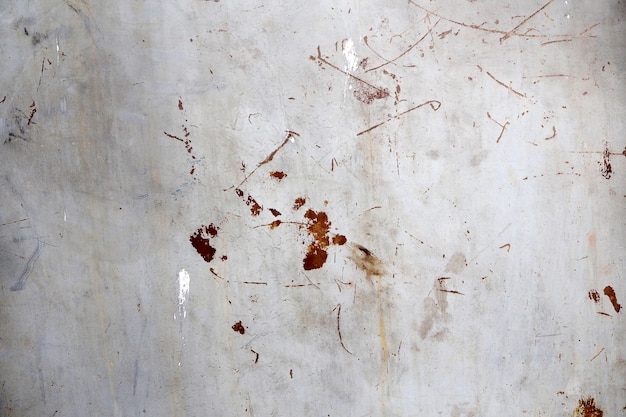 Metal surface with scratches and traces of paint