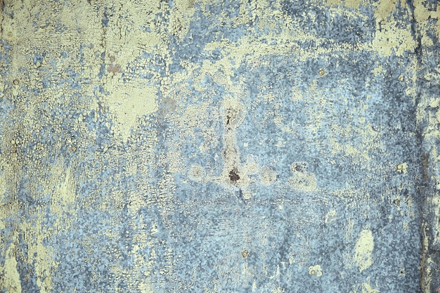 Metal texture, rusty metal with peeling paint, pieces of metal with welds. Background, copy space.