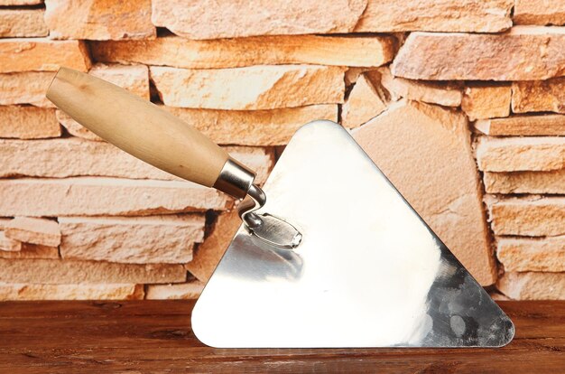 Photo metal tool for building on brick wall background