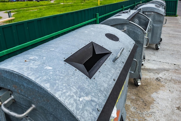 Metal trash cans for separate waste collection in a densely populated area of the city