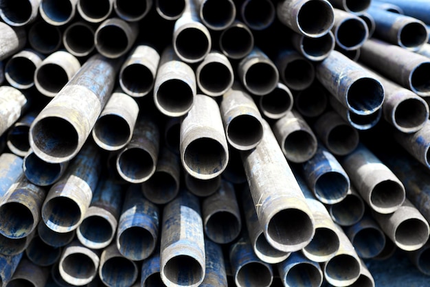 Metal tubes stacked in row pattern