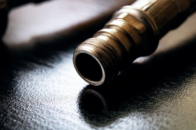 Metal water pipes on a wooden table