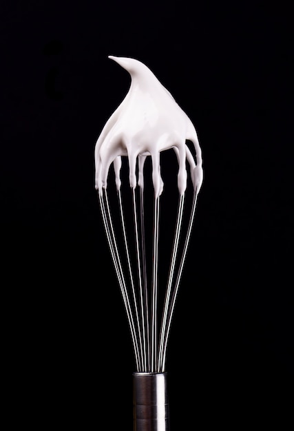 Metal whisk with whipped egg whites