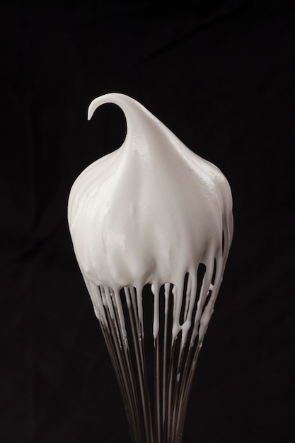Metal whisk with whipped egg whites
