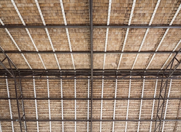 Metal and wooden frame with the dry palm leaves.