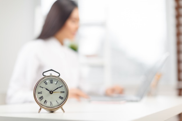 Metallic alarm clock on the table