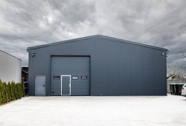 Metallic black garage with roller doors industrial warehouse