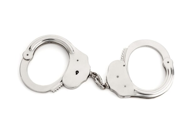Photo metallic handcuffs isolated on white background