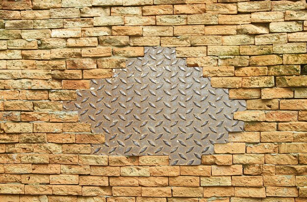  Metallic material on brick wall 