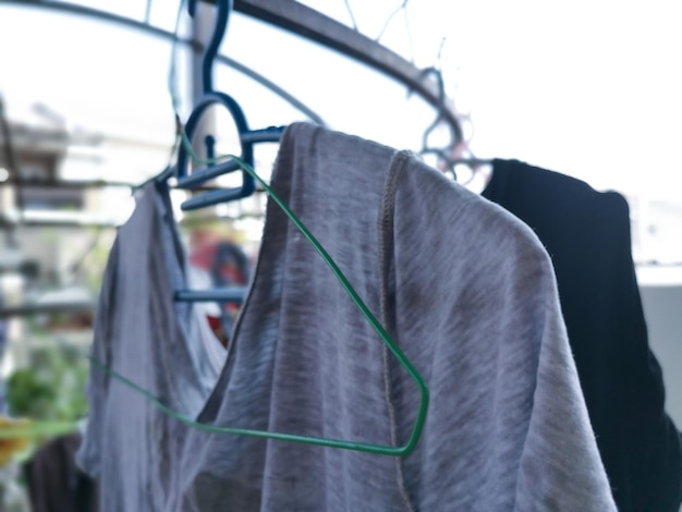 Metallic or plastic hangers and clips use to dry clothes outdoor at the open space porch