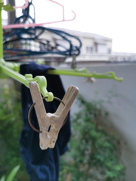 Metallic or plastic hangers and clips use to dry clothes outdoor at the open space porch