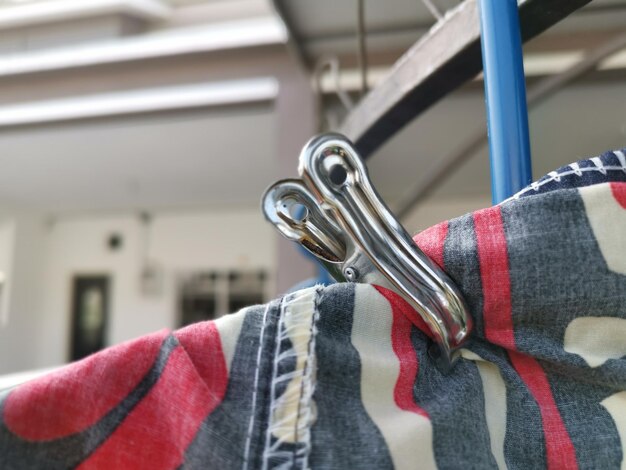 Metallic or plastic hangers and clips use to dry clothes outdoor at the open space porch