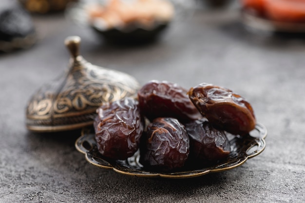 Photo metallic plate of pitted dates for ramadan