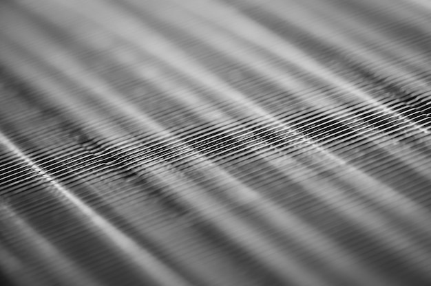 Metallic ribbed seamless texture in blur. Steel.