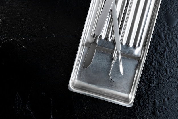 Photo metallic tray with medical scalpel