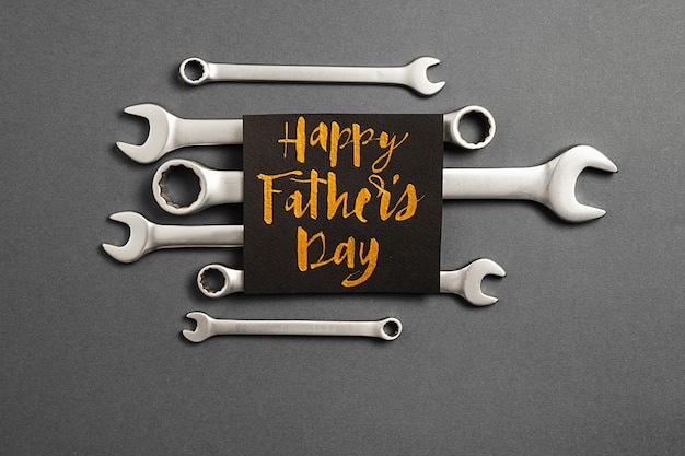 Metallic wrenches with a greeting card