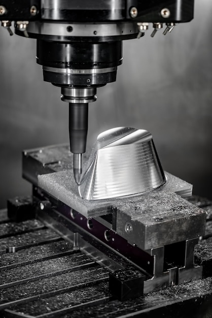 Metalworking CNC milling machine. Cutting metal modern processing technology. Small depth of field. Warning - authentic shooting in challenging conditions. A little bit grain and maybe blurred.