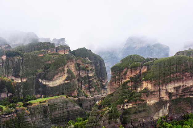 Meteora mountains in Greece during rain cloudy sky