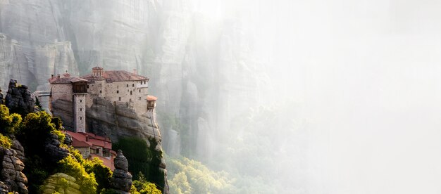 Meteors monasteries in Greece in high mountains, at the sunset