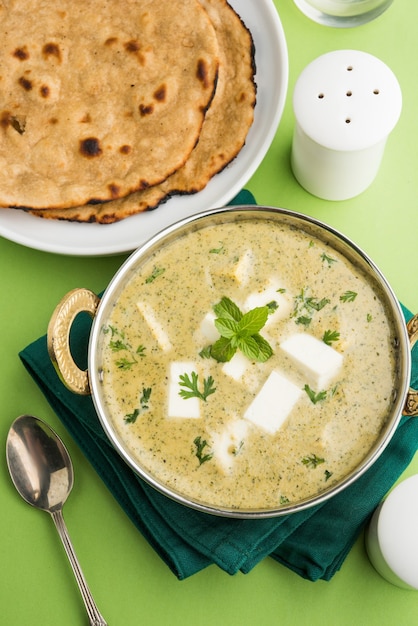 Methi Malai Paneer or Creamy Fenugreek &amp; Cottage Cheese Curry,  Popular North Indian recipe, served in Karahi with Roti/Paratha, selective focus