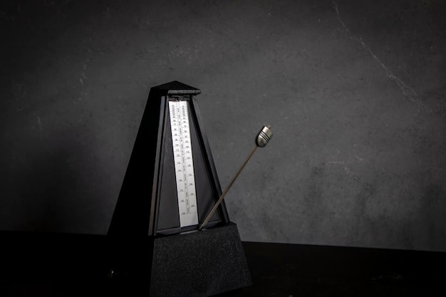 Metronome in action isolated and on a plain background