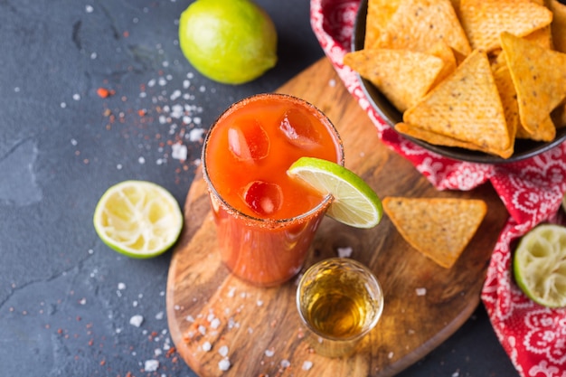 Mexican alcohol cocktail chavela served with tequila shot