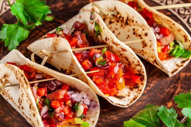 Mexican appetizer Tacos with vegetables.