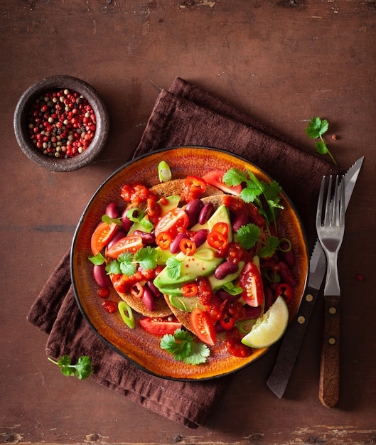 Mexican avocado bean sandwich with tomato chili scallion