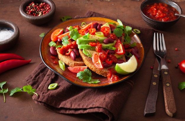 Mexican avocado bean sandwich with tomato chili scallion