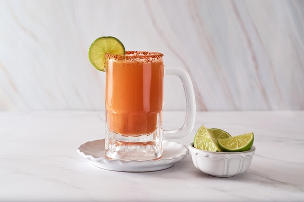 Mexican cocktail michelada made with beer and tomato juice