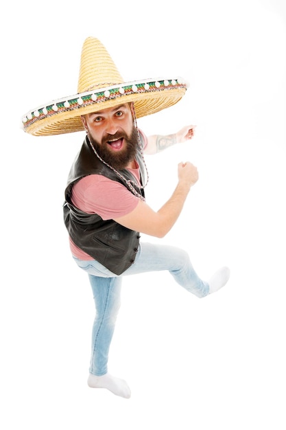 Mexican energetic temper. Man bearded cheerful guy wear sombrero mexican hat. Mexican party concept. Celebrate traditional mexican holiday. Guy happy cheerful face having fun dancing and jumping.