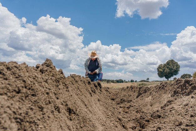 A mexican farmer planting corn panoramic view