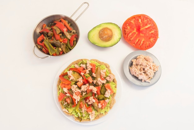 Mexican food integral fajita with tuna pepper tomato and avocado