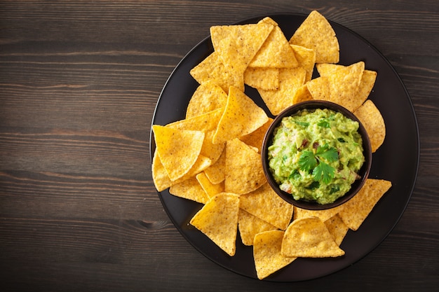 Mexican guacamole dip and nachos tortilla chips