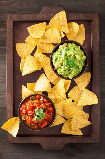 Mexican guacamole and salsa dip with nachos