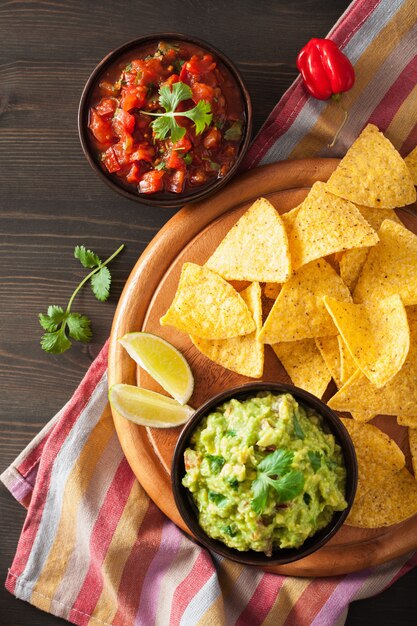 Mexican guacamole and salsa dip with nachos