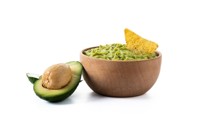 Mexican guacamole with nacho chip isolated on white background