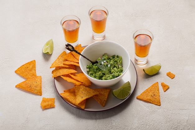 Mexican Guacasole rice chips and tequila