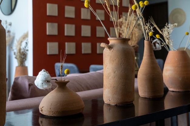 Mexican interior style with vases and natural wood mexican\
design interior design