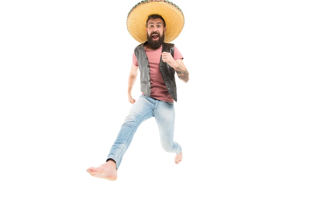 Mexican party concept Celebrate traditional mexican holiday Guy happy cheerful face having fun dancing jumping Life in motion Man bearded cheerful guy wear sombrero mexican hat Always in motion