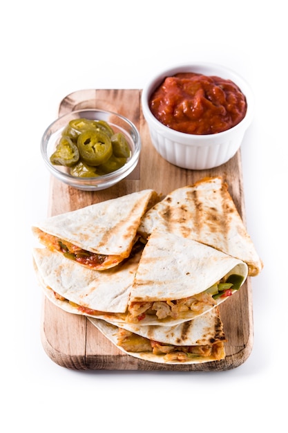 Mexican quesadilla with chicken, cheese and peppers, isolated 