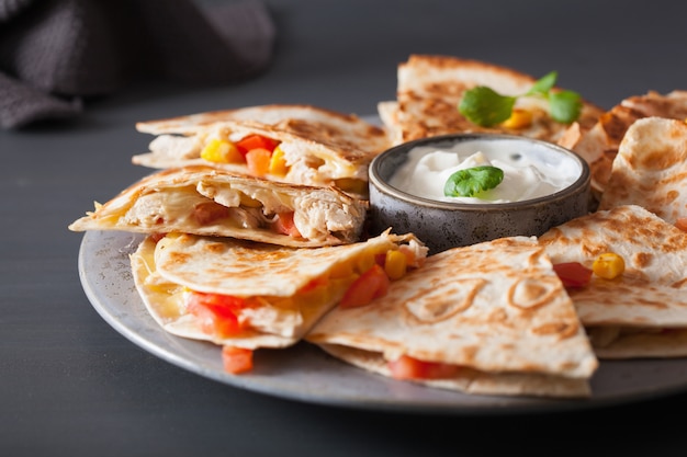 Mexican quesadilla with chicken, tomato, sweet corn and cheese