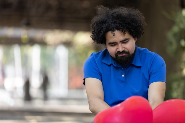 Mexican sad man sitting on the floor bad date Valentine39s day copy space