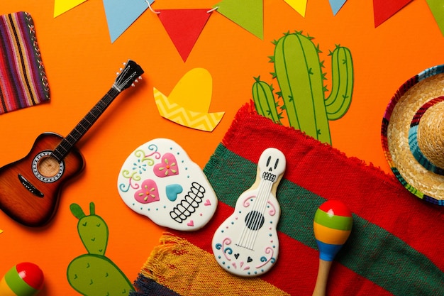 Mexican symbols for the day of the dead on an orange background