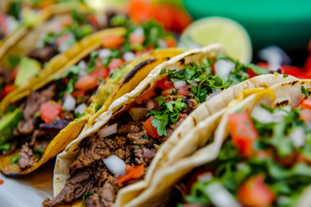 Mexican tacos with beef and vegetables closeup selective focus