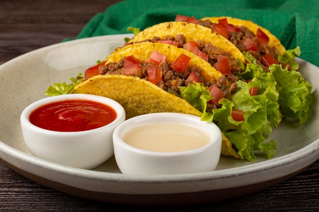 Mexican tacos with lettuce beef and tomatoes