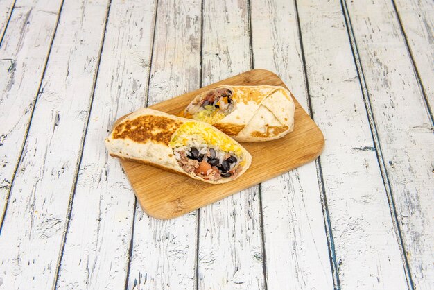 Mexican Toasted Wheat Tortilla Burrito with Pulled Pork Black Beans Rice and Cheddar Cheese