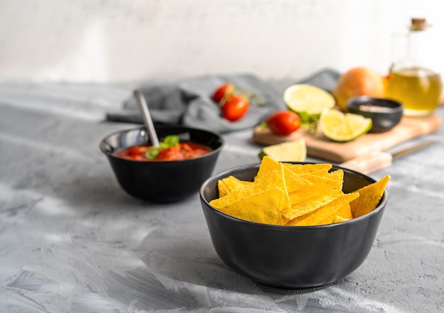 Mexican tomato dip with nachos tortilla and basic ingredients