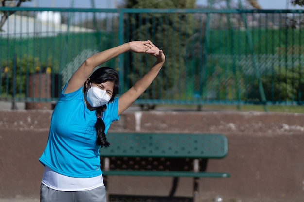 Mexican woman stretching outdoors